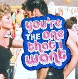 Embleem 'You're the one that I want' blauw/roze/wit.